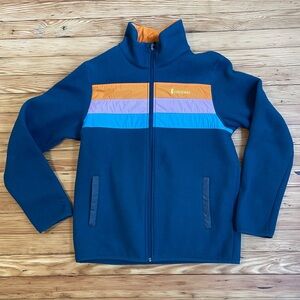 cotopaxi Navy Blue Jacket with Orange, Lavender, and Aqua Stripes
